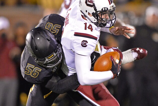 COLUMBIA, MO - OCTOBER 26:  Defensive linemen Shane Ray #56 of the Missouri Tigers sacks quarterback Connor Shaw #14 of the South Carolina Gamecocks during the second half on October 26, 2013 at Faurot Field/Memorial Stadium in Columbia, Missouri.  South Carolina defeated Missouri in double overtime 27-24. (Photo by Peter Aiken/Getty Images)