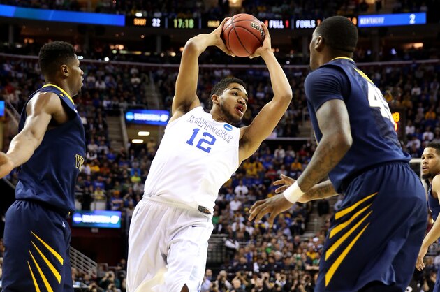 CLEVELAND, OH - MARCH 26: Karl-Anthony Towns #12 of the Kentucky Wildcats handles the ball in the first half against the West Virginia Mountaineers during the Midwest Regional semifinal of the 2015 NCAA Men's Basketball Tournament at Quicken Loans Arena on March 26, 2015 in Cleveland, Ohio.  (Photo by Andy Lyons/Getty Images)