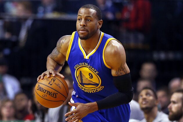Golden State Warriors' Andre Iguodala brings the ball up court against the Boston Celtics during the second quarter of an NBA basketball game in Boston Sunday, March 1, 2015. (AP Photo/Winslow Townson)