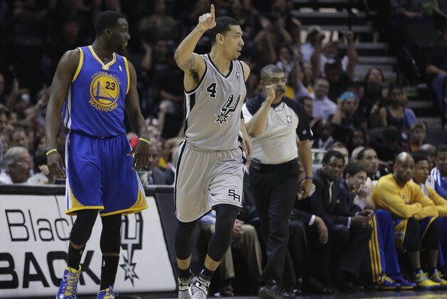 San Antonio Spurs' Danny Green (4) reacts after a score as he runs past Golden State Warriors' Draymond Green  during the second half of Game 1 of a Western Conference semifinal NBA basketball playoff series, Monday, May 6, 2013, in San Antonio. (AP Photo/Eric Gay)