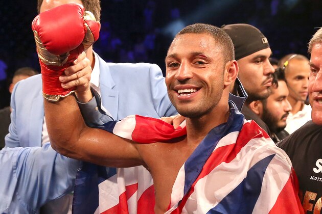 LOS ANGELES, CA - AUGUST 16:  Kell Brook poses with his belt and flag after getting the decision over Shawn Porter in their IBF Welterweight World Championship fight at StubHub Center on August 16, 2014 in Los Angeles, California.  (Photo by Stephen Dunn/Getty Images)