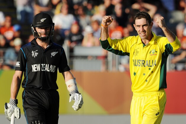 Australia's Glenn Maxwell celebrates after taking the wicket of New Zealand’s Corey Anderson as New Zealand’s Kane Williamson, left, watches during their Cricket World Cup match in Auckland, New Zealand, Saturday, Feb. 28, 2015. (AP Photo Ross Setford)