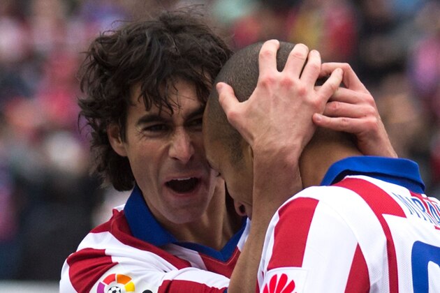 MADRID, SPAIN - FEBRUARY 07: Tiago Mendes (L) of Atletico de Madrid celebrates scoring their opening goal with teammate Joao Miranda (R) during the La Liga match between Club Atletico de Madrid and Real Madrid CF at Vicente Calderon Stadium on February 7, 2015 in Madrid, Spain.  (Photo by Gonzalo Arroyo Moreno/Getty Images)