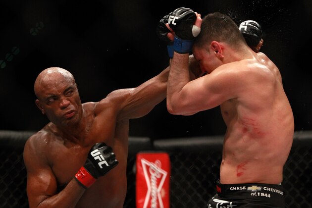 LAS VEGAS, NV - JANUARY 31:  Anderson Silva punches at Nick Diaz in their middleweight bout during UFC 183 at the MGM Grand Garden Arena on January 31, 2015 in Las Vegas, Nevada. Silva won by unanimous decision.  (Photo by Steve Marcus/Getty Images)