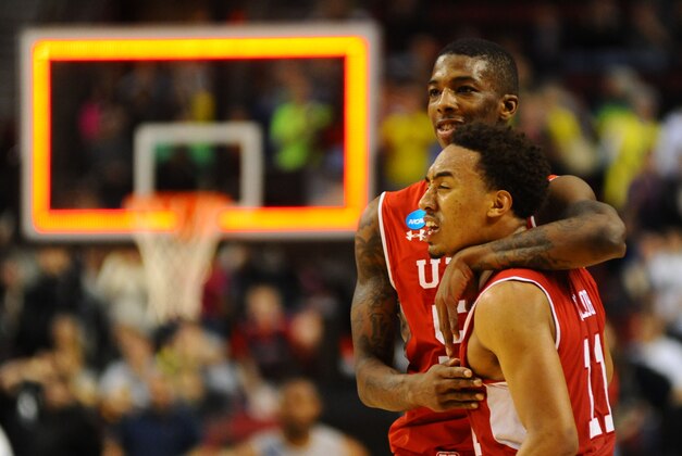 Mar 21, 2015; Portland, OR, USA; Utah Utes guard Delon Wright (back) and guard Brandon Taylor (11) celebrate after the game against the Georgetown Hoyas in the third round of the 2015 NCAA Tournament at Moda Center. The Utes defeated the Hoyas 75-64. Mandatory Credit: Godofredo Vasquez-USA TODAY Sports