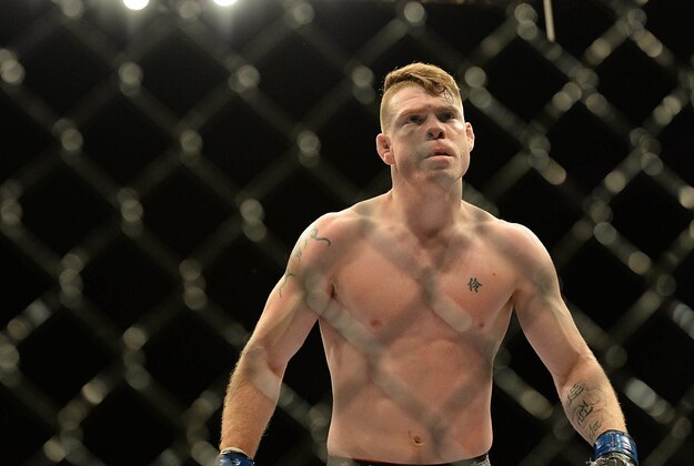 Jan 3, 2015; Las Vegas, NV, USA; Paul Felder (blue gloves) reacts after he defeated Danny Castillo (red gloves) in their lightweight bout at UFC 182 at MGM Grand Garden Arena. Mandatory Credit: Jayne Kamin-Oncea-USA TODAY Sports