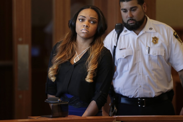 Shayanna Jenkins, left, girlfriend of former New England Patriots' Aaron Hernandez, appears in superior court, in Fall River, Mass., Tuesday, Oct. 15, 2013, during her arraignment on a perjury charge in connection with the killing of Hernandez's friend. Authorities say Jenkins, 24, was untruthful in her testimony before the grand jury investigating the death of Odin Lloyd. (AP Photo/Steven Senne, Pool)