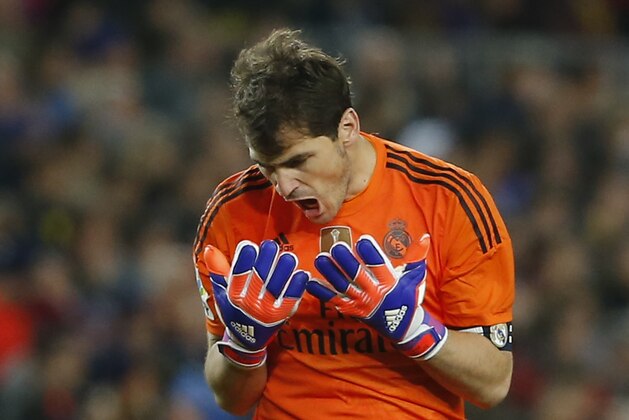 Real Madrid's goalkeeper Iker Casillas screams during a Spanish La Liga soccer match between FC Barcelona and Real Madrid at Camp Nou stadium, in Barcelona, Spain, Sunday, March 22, 2015. (AP Photo/Emilio Morenatti)