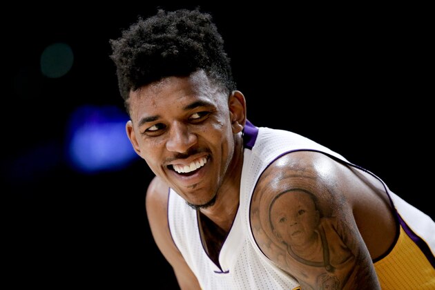 Los Angeles Lakers forward Nick Young smiles during the second half of an NBA basketball game against the Boston Celtics in Los Angeles, Sunday, Feb. 22, 2015. The Los Angeles Lakers won 118-111 in overtime. (AP Photo/Chris Carlson)