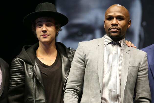 LOS ANGELES, CA - MARCH 11:  Justin Bieber appears on stage with Floyd Mayweather Jr.at the  Floyd Mayweather v Manny Pacquiao  Press Conference on March 11, 2015 in Los Angeles, California.  (Photo by Stephen Dunn/Getty Images)