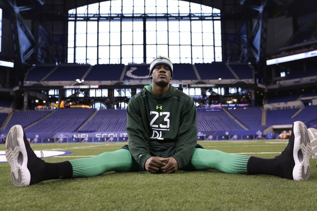 Nebraska defensive lineman Randy Gregory stretches before drills at the NFL football scouting combine in Indianapolis, Sunday, Feb. 22, 2015. (AP Photo/David J. Phillip)