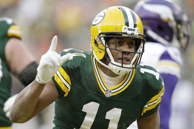 GREEN BAY, WI - NOVEMBER 24:  Jarrett Boykin #11 of the Green Bay Packers after a reception against the Minnesota Vikings defense at Lambeau Field on November 24, 2013 in Green Bay, Wisconsin.  (Photo Tom Lynn /Getty Images)