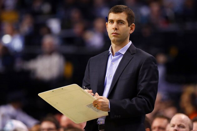 Boston Celtics head coach Brad Stevens prepares to diagram a play during the second half of the Miami Heat's 83-75 win over the Boston Celtics an NBA basketball game in Boston Sunday, Feb. 1, 2015. (AP Photo/Winslow Townson)