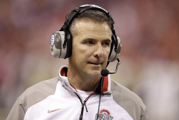Ohio State head coach Urban Meyer watches from the sidelines during the second half of the Big Ten Conference championship NCAA college football game against Wisconsin Saturday, Dec. 6, 2014, in Indianapolis. (AP Photo/Darron Cummings)