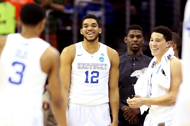 CLEVELAND, OH - MARCH 26: Karl-Anthony Towns #12 and Devin Booker #1 of the Kentucky Wildcats react late in the game against the West Virginia Mountaineers during the Midwest Regional semifinal of the 2015 NCAA Men's Basketball Tournament at Quicken Loans Arena on March 26, 2015 in Cleveland, Ohio.  (Photo by Andy Lyons/Getty Images)