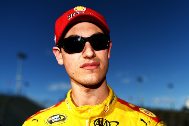 AVONDALE, AZ - MARCH 13:  Joey Logano, driver of the #22 Shell-Pennzoil Ford, stands on the grid during qualifying for the NASCAR Sprint Cup Series CampingWorld.com 500 at Phoenix International Raceway on March 13, 2015 in Avondale, Arizona.  (Photo by Rainier Ehrhardt/Getty Images)