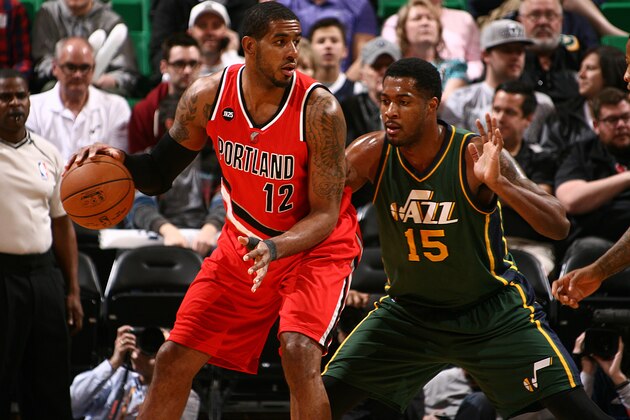 SALT LAKE CITY, UT - MARCH 25:  LaMarcus Aldridge #12 of the Portland Trail Blazers handles the ball against Derrick Favors #15 of the Utah Jazz on March 25, 2015 at EnergySolutions Arena in Salt Lake City, Utah. NOTE TO USER: User expressly acknowledges and agrees that, by downloading and or using this photograph, User is consenting to the terms and conditions of the Getty Images License Agreement.  Mandatory Copyright Notice:  Copyright 2015 NBAE (Photo by Melissa Majchrzak/NBAE via Getty Images)