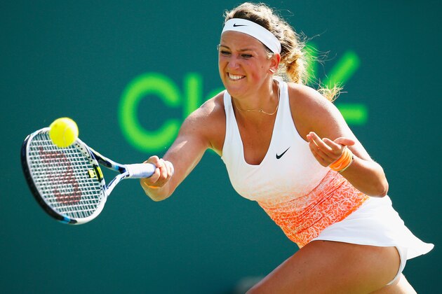 KEY BISCAYNE, FL - MARCH 25:  Victoria Azarenka of Belarus returns the ball to  Silvia Soler-Espinosa of Spain during day 3 of the Miami Open at Crandon Park Tennis Center on March 25, 2015 in Key Biscayne, Florida.  (Photo by Al Bello/Getty Images)