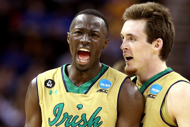 CLEVELAND, OH - MARCH 26:  Jerian Grant #22 of the Notre Dame Fighting Irish celebrates with Pat Connaughton #24 after a play in the second half against the Wichita State Shockers during the Midwest Regional semifinal of the 2015 NCAA Men's Basketball Tournament at Quicken Loans Arena on March 26, 2015 in Cleveland, Ohio.  (Photo by Andy Lyons/Getty Images)