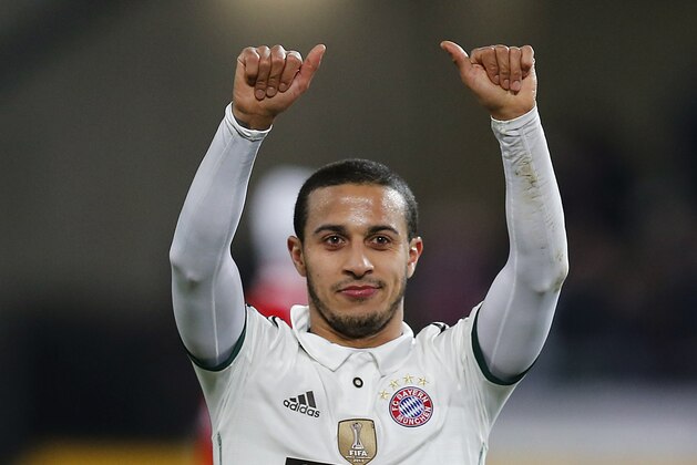 Bayern's Thiago Alcantara of Spain celebrates after winning the German first division Bundesliga soccer match between Hannover 96 and Bayern Munich in Hannover, Germany, Sunday, Feb. 23, 2014. (AP Photo/Frank Augstein)