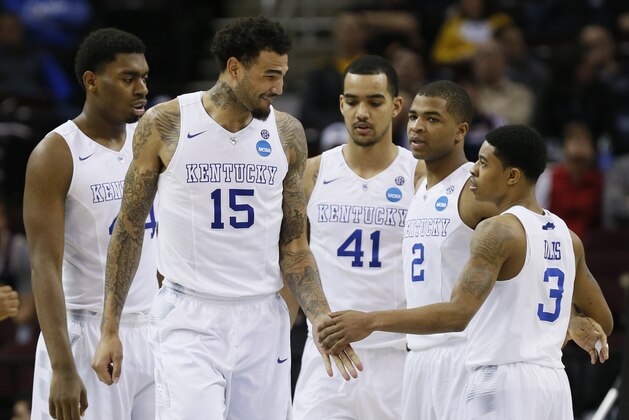 Mar 26, 2015; Cleveland, OH, USA; Kentucky Wildcats forward Willie Cauley-Stein (15) greets guard Tyler Ulis (3) during the second half against the West Virginia Mountaineers in the semifinals of the midwest regional of the 2015 NCAA Tournament at Quicken Loans Arena. Mandatory Credit: Rick Osentoski-USA TODAY Sports