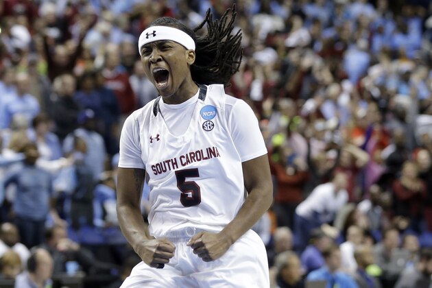 South Carolina's Khadijah Sessions (5) celebrates following a women's college basketball regional semifinal game against North Carolina in the NCAA Tournament Greensboro, N.C., Friday, March 27, 2015. South Carolina won 67-65. (AP Photo/Gerry Broome)