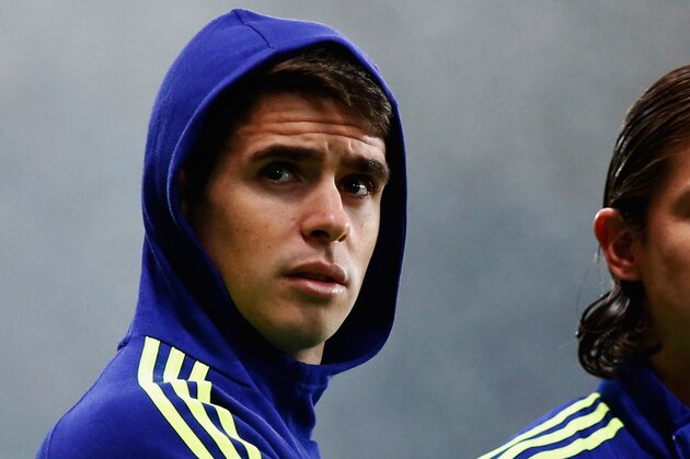 PARIS, FRANCE - FEBRUARY 17:  Oscar (L) and Filipe Luis of Chelsea look on prior to the UEFA Champions League Round of 16 match between Paris Saint-Germain and Chelsea at Parc des Princes on February 17, 2015 in Paris, France.  (Photo by Clive Rose/Getty Images)