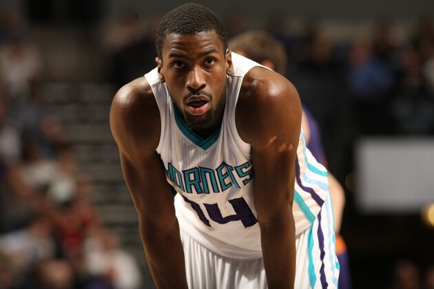 CHARLOTTE, NC - DECEMBER 17:  Michael Kidd-Gilchrist #14 of the Charlotte Hornets stands on the court against the Phoenix Suns at the Time Warner Cable Arena on December 17, 2014 in Charlotte, North Carolina. NOTE TO USER: User expressly acknowledges and agrees that, by downloading and or using this photograph, User is consenting to the terms and conditions of the Getty Images License Agreement.  Mandatory Copyright Notice:  Copyright 2014 NBAE (Photo by Kent Smith/NBAE via Getty Images)