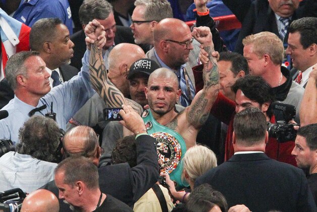 Jun 7, 2014; New York, NY, USA;  Miguel  Cotto reacts after a TKO against Sergio Martinez in the tenth round of WBC World Middleweight fight at Madison Square Garden. Mandatory Credit: Noah K. Murray-USA TODAY Sports
