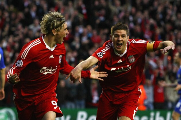 LIVERPOOL, ENGLAND - APRIL 08:  Fernando Torres of Liverpool celebrates scoring the opening goal with team mate Steven Gerrard (R) during the UEFA Champions League Quarter Final First Leg match between Liverpool and Chelsea at Anfield on April 8, 2009 in Liverpool, England.  (Photo by Clive Rose/Getty Images)