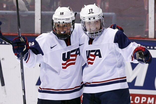 United States' Jocelyne Lamoureux (17) celebrates her goal against Sweden with teammate Kelli Stack (16) during the second period of a Four Nations Cup women's third-place hockey game on Saturday, Nov. 9, 2013, in Lake Placid, N.Y. (AP Photo/Mike Groll) United States' Jocelyne Lamoureux (17) celebrates her goal against Sweden with teammate Kelli Stack (16) during the second period of a Four Nations Cup women's third-place hockey game on Saturday, Nov. 9, 2013, in Lake Placid, N.Y. (AP Photo/Mike Groll)