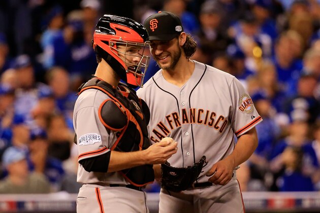 KANSAS CITY, MO - OCTOBER 21:  Madison Bumgarner #40 and Buster Posey #28 of the San Francisco Giants talk during Game One of the 2014 World Series against the Kansas City Royals at Kauffman Stadium on October 21, 2014 in Kansas City, Missouri.  (Photo by Rob Carr/Getty Images)