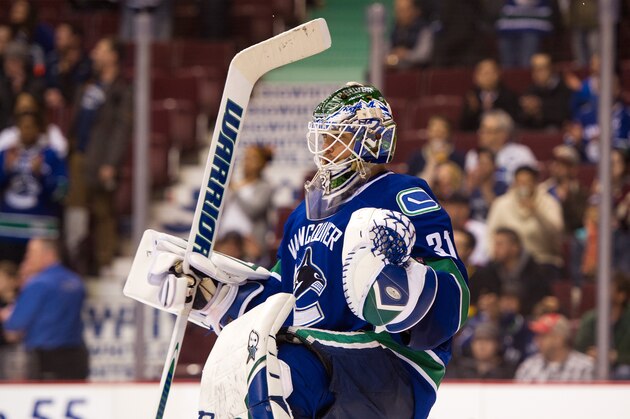 VANCOUVER, BC - MARCH 24: Goalie Eddie Lack #31 of the Vancouver Canucks celebrates after defeating the Winnipeg Jets 5-2 in NHL action on March, 24, 2015 at Rogers Arena in Vancouver, British Columbia, Canada.  (Photo by Rich Lam/Getty Images)