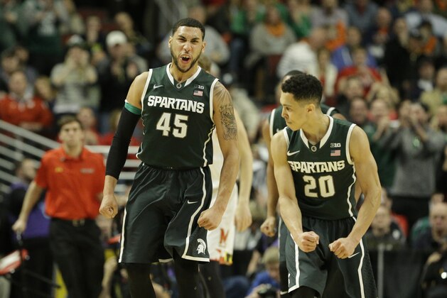 Michigan State's Denzel Valentine (45) and  Travis Trice (20) celebrate in the second  half of an NCAA college basketball game against Maryland in the semifinals of the Big Ten Conference tournament in Chicago, Saturday, March 14, 2015. (AP Photo/Nam Y. Huh)