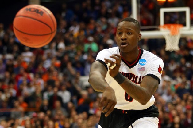 SYRACUSE, NY - MARCH 27:  Terry Rozier #0 of the Louisville Cardinals in action against the North Carolina State Wolfpack during the East Regional Semifinal of the 2015 NCAA Men's Basketball Tournament at the Carrier Dome on March 27, 2015 in Syracuse, New York.  (Photo by Elsa/Getty Images)