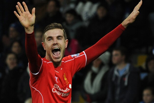Liverpool's Jordan Henderson celebrates after scoring against Leicester during the English Premier League soccer match between Leicester City and Liverpool at King Power Stadium, in Leicester, England, Tuesday, Dec. 2, 2014. (AP Photo/Rui Vieira)