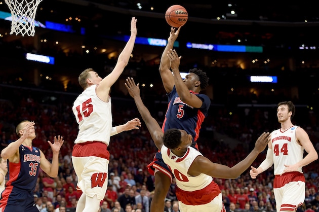 LOS ANGELES, CA - MARCH 28:  Stanley Johnson #5 of the Arizona Wildcats is called for a charge on Nigel Hayes #10 of the Wisconsin Badgers in the first half during the West Regional Final of the 2015 NCAA Men's Basketball Tournament at Staples Center on March 28, 2015 in Los Angeles, California.  (Photo by Harry How/Getty Images)