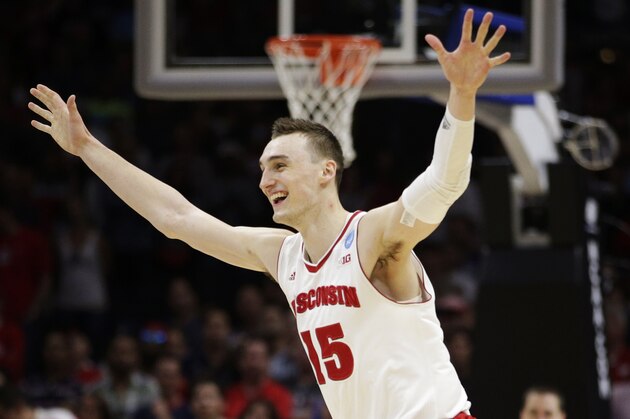 Wisconsin forward Sam Dekker (15) celebrates after Wisconsin beat Arizona 85-78 in a college basketball regional final in the NCAA Tournament, Saturday, March 28, 2015, in Los Angeles. Wisconsin advances to the Final Four in Indianapolis. (AP Photo/Jae C. Hong)