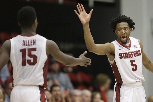 Stanford's Marcus Allen (15) and Chasson Randle (5) celebrates during the second half of an NCAA college basketball game in the National Invitation Tournament against Vanderbilt in Stanford, Calif., Tuesday, March 24, 2015. Stanford won 78-75. (AP Photo/Jeff Chiu)