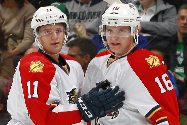 VANCOUVER, BC - JANUARY 8:  Jonathan Huberdeau #11 congratulates Aleksander Barkov #16 of the Florida Panthers who scored against the Vancouver Canucks during their NHL game at Rogers Arena January 8, 2015 in Vancouver, British Columbia, Canada.  (Photo by Jeff Vinnick/NHLI via Getty Images)