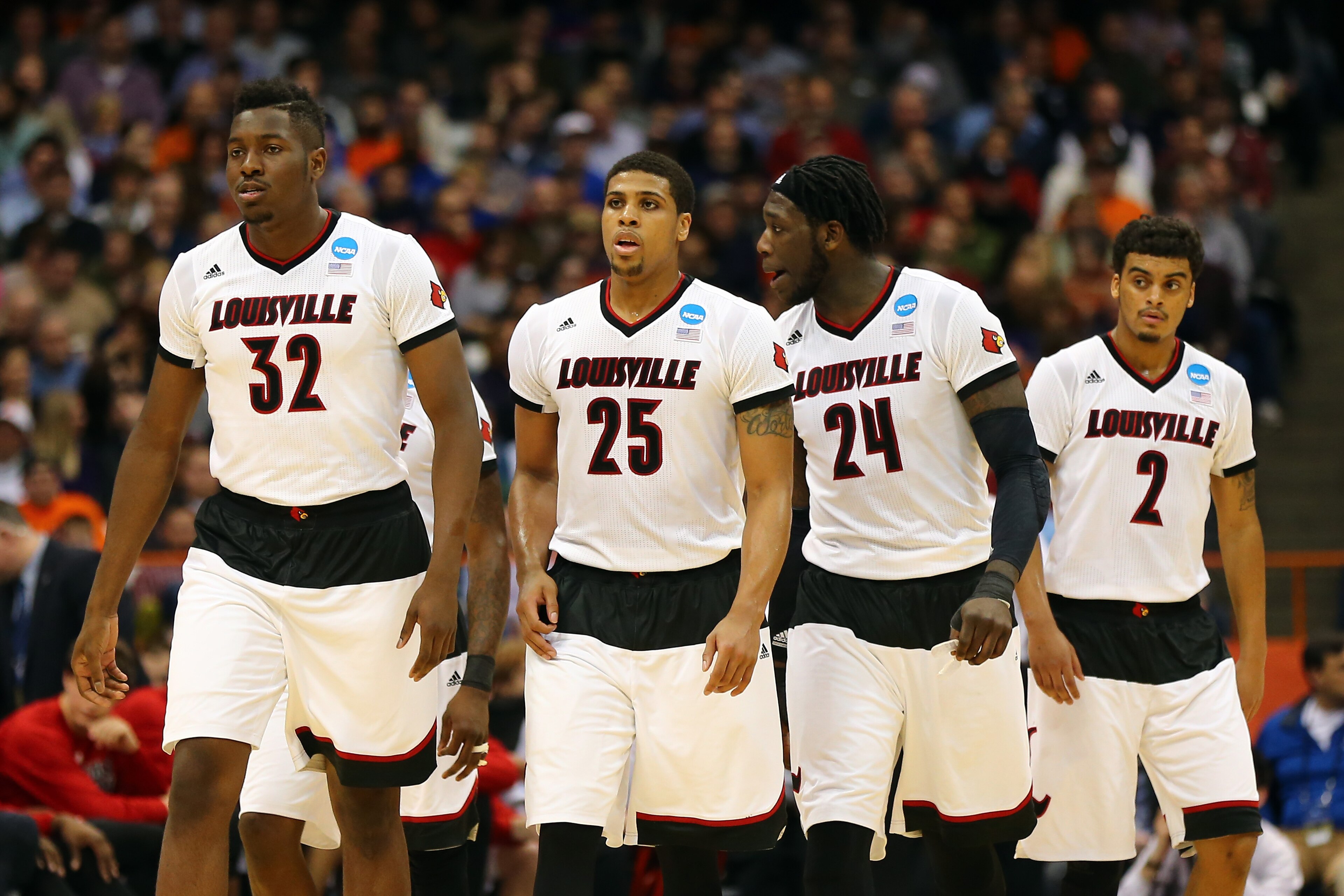 SYRACUSE, NY - MARCH 27:  Chinanu Onuaku #32, Wayne Blackshear #25, Montrezl Harrell #24 and Quentin Snider #2 of the Louisville Cardinals walk on court against the North Carolina State Wolfpack during the East Regional Semifinal of the 2015 NCAA Men's Basketball Tournament at the Carrier Dome on March 27, 2015 in Syracuse, New York.  (Photo by Elsa/Getty Images)