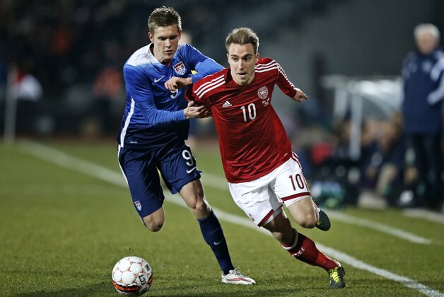 Aron Johannsson from the US, left, challenges Christian Eriksen from Denmark during a friendly soccer match at NRGI Stadium in Aarhus, Denmark, Wednesday March 25, 2015. (AP Photo/POLFOTO, Jens Dresling)  DENMARK OUT
