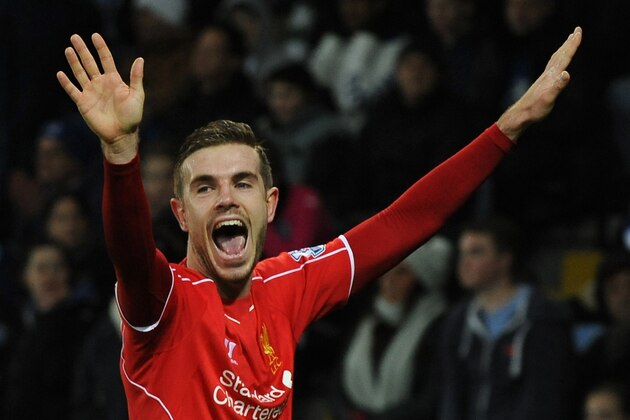 Liverpool's Jordan Henderson celebrates after scoring against Leicester during the English Premier League soccer match between Leicester City and Liverpool at King Power Stadium, in Leicester, England, Tuesday, Dec. 2, 2014. (AP Photo/Rui Vieira)