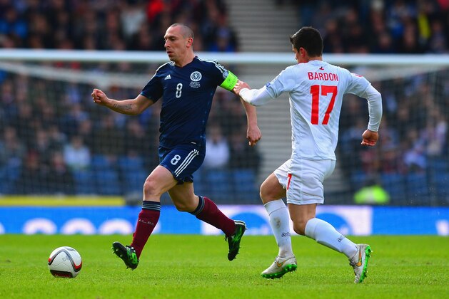 GLASGOW, SCOTLAND - MARCH 29:  Anthony Bardon of Gibraltar marshalls Scott Brown of Scotland during the EURO 2016 Qualifier match between Scotland and Gibraltar at Hampden Park on March 29, 2015 in Glasgow, Scotland.  (Photo by Mark Runnacles/Getty Images)