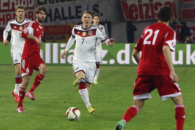 Germany’s Bastian Schweinsteiger, center, attacks during the Euro 2016 qualifying match between Germany and Georgia, in Tbilisi, Georgia, Sunday, March 29, 2015. (AP Photo/Shakh Aivazov)