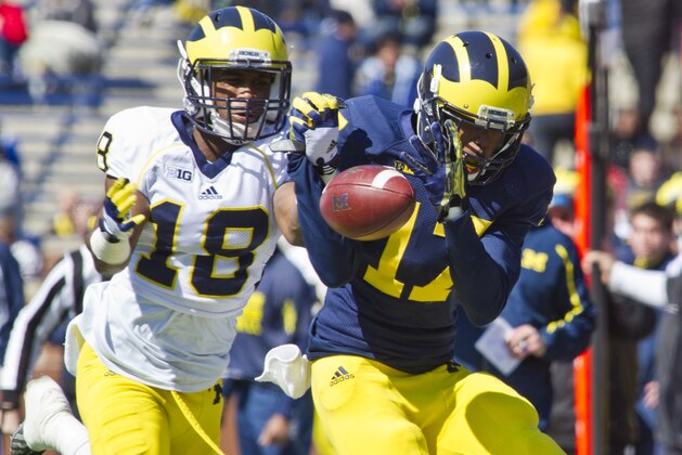 Michigan defensive back Blake Countess (18) breaks up a pass intended for wide receiver Freddy Canteen (17), during the football team's annual spring game, Saturday, April 5, 2014, in Ann Arbor, Mich. (AP Photo/Tony Ding)
