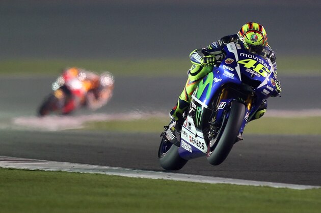 Italian MotoGP rider Valentino Rossi of the Movistar Yamaha MotoGP team steers his bike during a final session of the Moto GP World Championship at the Losail International Circuit in Doha, Qatar, Sunday, March 29, 2015. (AP Photo/Osama Faisal)