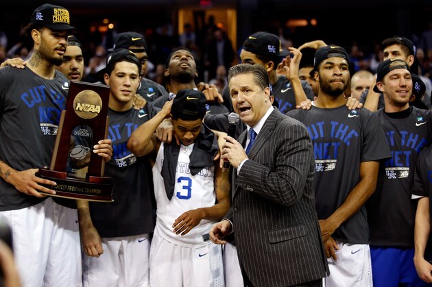 CLEVELAND, OH - MARCH 28: Head coach John Calipari of the Kentucky Wildcats looks on with his team and their trophy after defeating the Notre Dame Fighting Irish during the Midwest Regional Final of the 2015 NCAA Men's Basketball tournament at Quicken Loans Arena on March 28, 2015 in Cleveland, Ohio. (Photo by Gregory Shamus/Getty Images) CLEVELAND, OH - MARCH 28: Head coach John Calipari of the Kentucky Wildcats looks on with his team and their trophy after defeating the Notre Dame Fighting Irish during the Midwest Regional Final of the 2015 NCAA Men's Basketball tournament at Quicken Loans Arena on March 28, 2015 in Cleveland, Ohio. (Photo by Gregory Shamus/Getty Images)