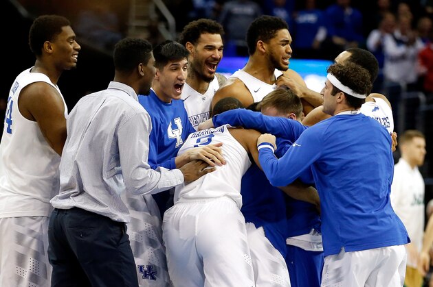 CLEVELAND, OH - MARCH 28:  The Kentucky Wildcats celebrate after defeating the Notre Dame Fighting Irish during the Midwest Regional Final of the 2015 NCAA Men's Basketball tournament at Quicken Loans Arena on March 28, 2015 in Cleveland, Ohio. Kentucky defeated Notre Dame 68-66.  (Photo by Gregory Shamus/Getty Images)