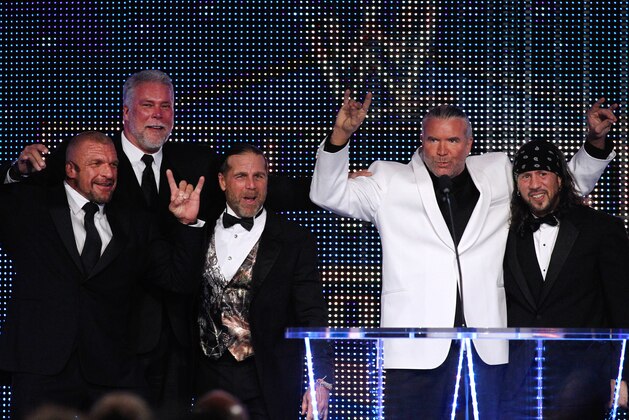 (left to right) Paul Levesque aka Triple H, Kevin Nash, Michael Shawn Hickenbottom aka Shawn Michaels, 2014 inductee Scott Hall aka Razor Ramon, and Sean Waltman aka X-Pac, are seen at the WWE Hall of Fame Induction at the Smoothie King Center in New Orleans on Saturday, April 5, 2014. (Jonathan Bachman/AP Images for WWE)